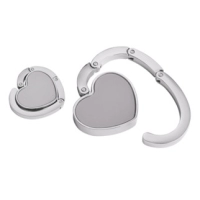 Gancho Porta Carteras plegable metalico forma de corazón, 5 cmts diametro